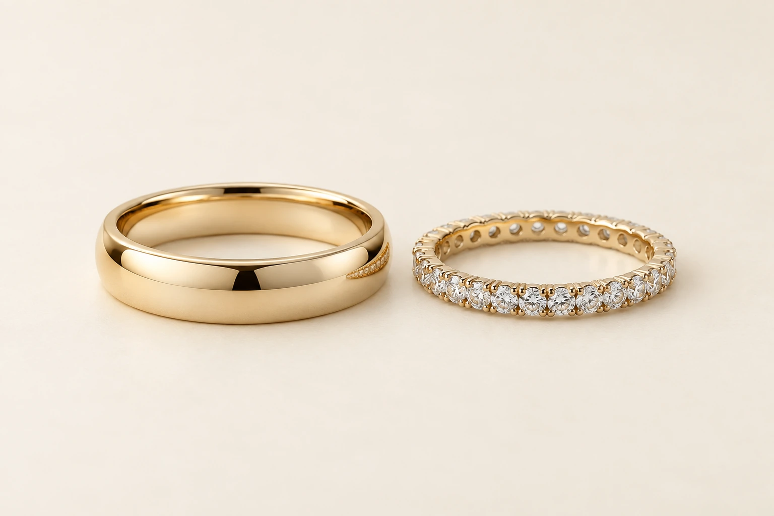 Smooth gold-tone band beside a clear-stone eternity ring
