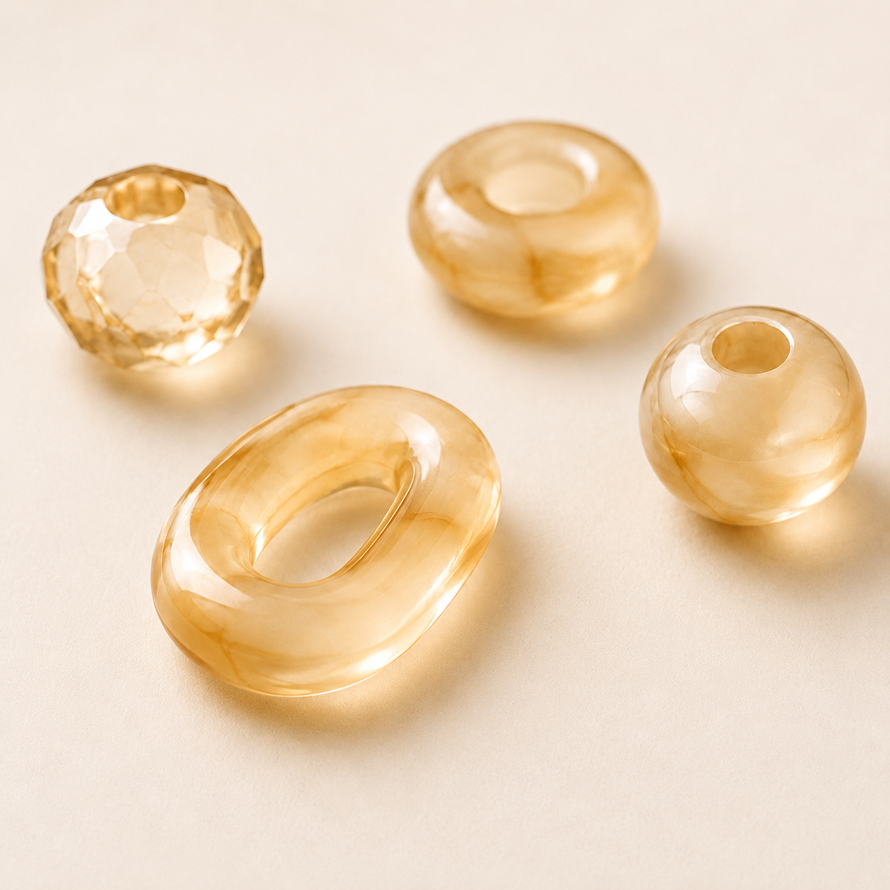 Premium resin jewelry material in polished tortoiseshell and neutral finishes