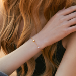 Gold Tone Heart Charm Pearl Look Chain Bracelet — second view thumbnail