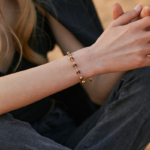 Gold Tone Burgundy Bead Bracelet — second view thumbnail