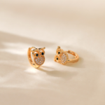 Gold Tone Clear Stone Owl Hoop Earrings — main view thumbnail