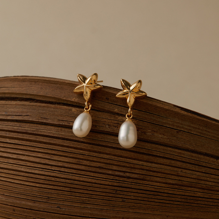 Gold Tone Five Petal Flower and Pearl Look Drop Earrings — product view