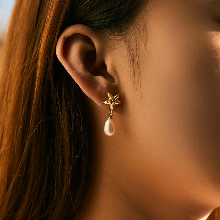 Gold Tone Five Petal Flower and Pearl Look Drop Earrings — second view