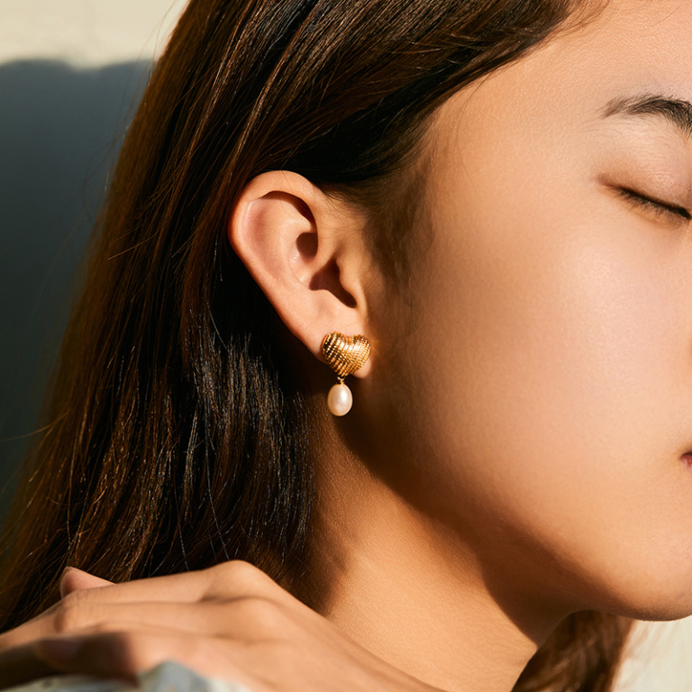Gold Tone Textured Heart and Pearl Look Drop Earrings — second view