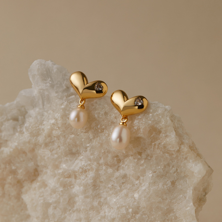 Gold Tone Polished Heart and Pearl Look Drop Earrings — product view